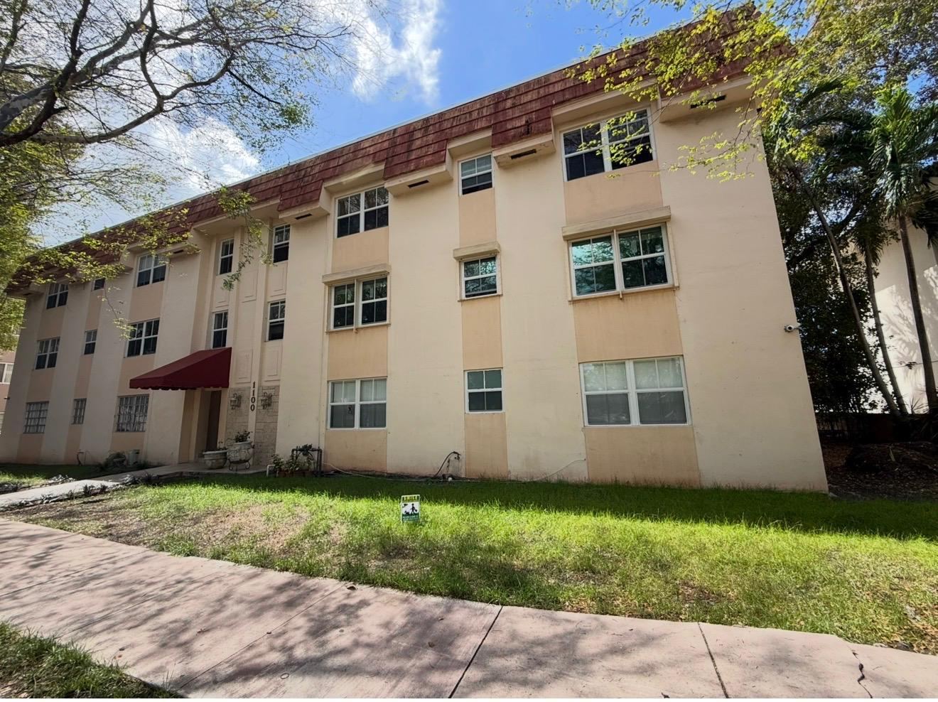 Apartment building before, peach paint