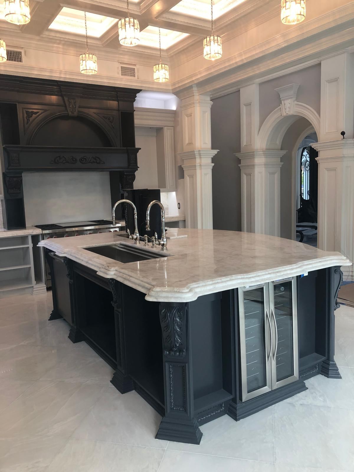 Luxury kitchen island and hood finished in black